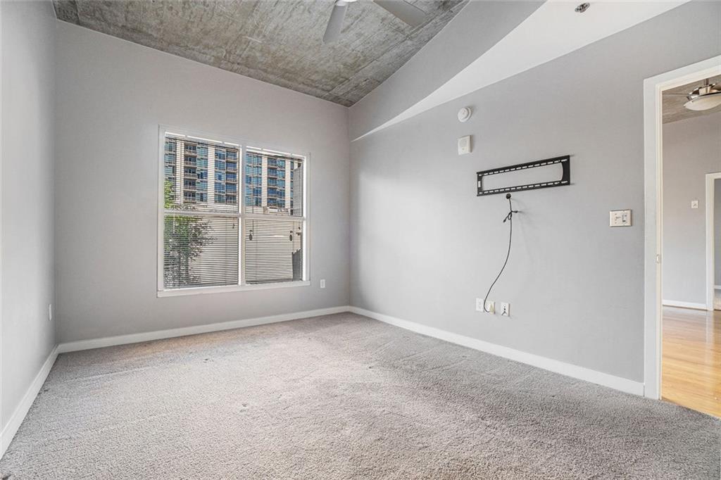 250 Pharr Road Northeast, Unit 405 Atlanta, GA 30305 - Photo 6 of 20 a view of an empty room with a window
