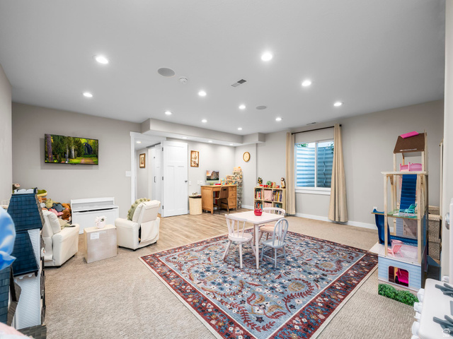 7 Sterling Loop Vineyard, UT 84059 - Photo 36 of 43 Spacious interior featuring recessed lighting, a window with blinds, and a combination of carpet and wood-finish flooring