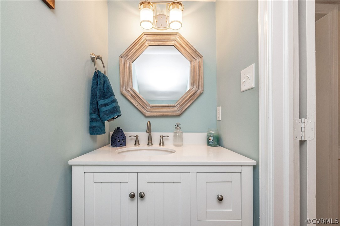 13821 Shadow Ridge Road Midlothian, VA 23112 - Photo 13 of 50 a bathroom with a sink and a mirror