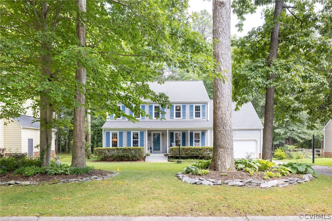 13821 Shadow Ridge Road Midlothian, VA 23112 - Photo 2 of 50 a front view of a house with a yard
