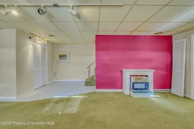 a room with furniture and a fireplace