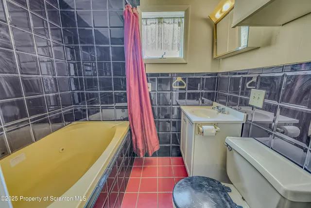 a picture of a room with a white wall and a large window