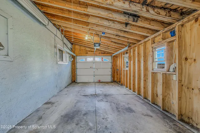 a view of a garage with wooden walls