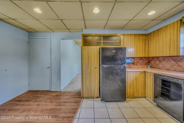 a view of an empty room with a fireplace