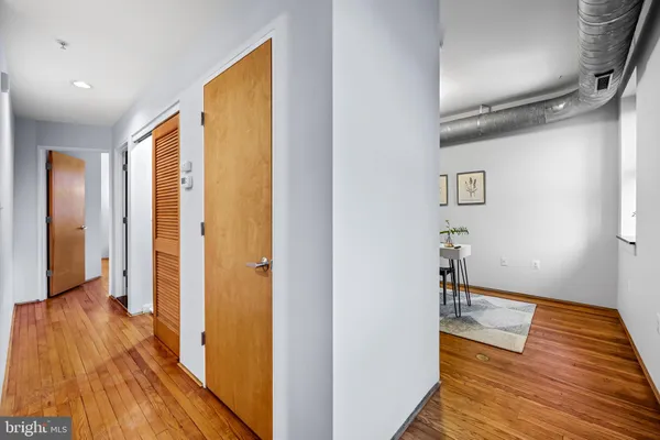 a view of hallway with wooden floor