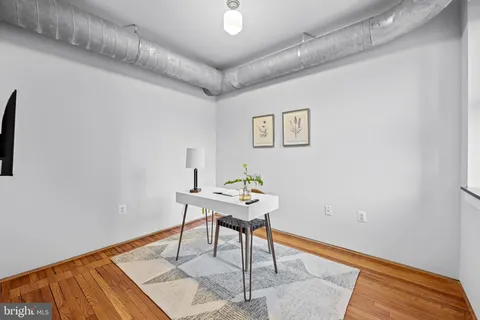a workspace with furniture and wooden floor