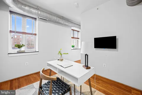 a view of a workspace with furniture