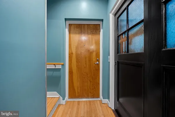 a view of walk in closet with empty room
