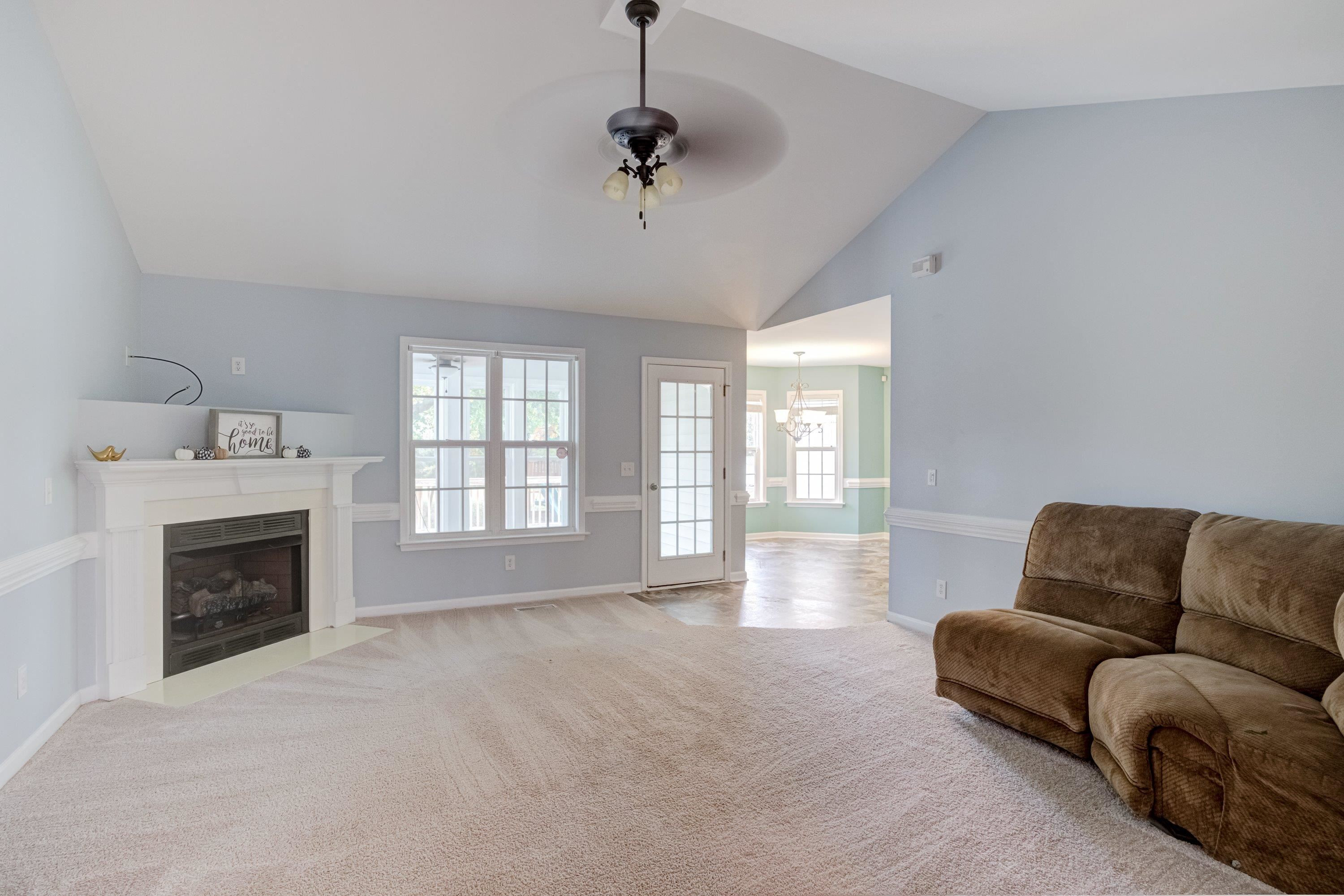 345 Axum Road Willow Spring, NC 27592 - Photo 10 of 38 Family room with corner fireplace & vaulted ceilings!