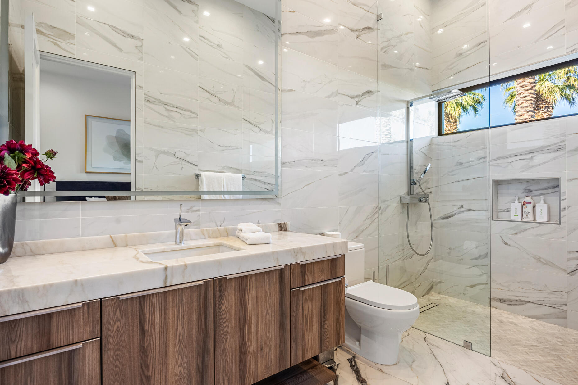 2 Bravo Court Rancho Mirage, CA 92270 - Photo 19 of 34 a bathroom with a sink toilet vanity and shower