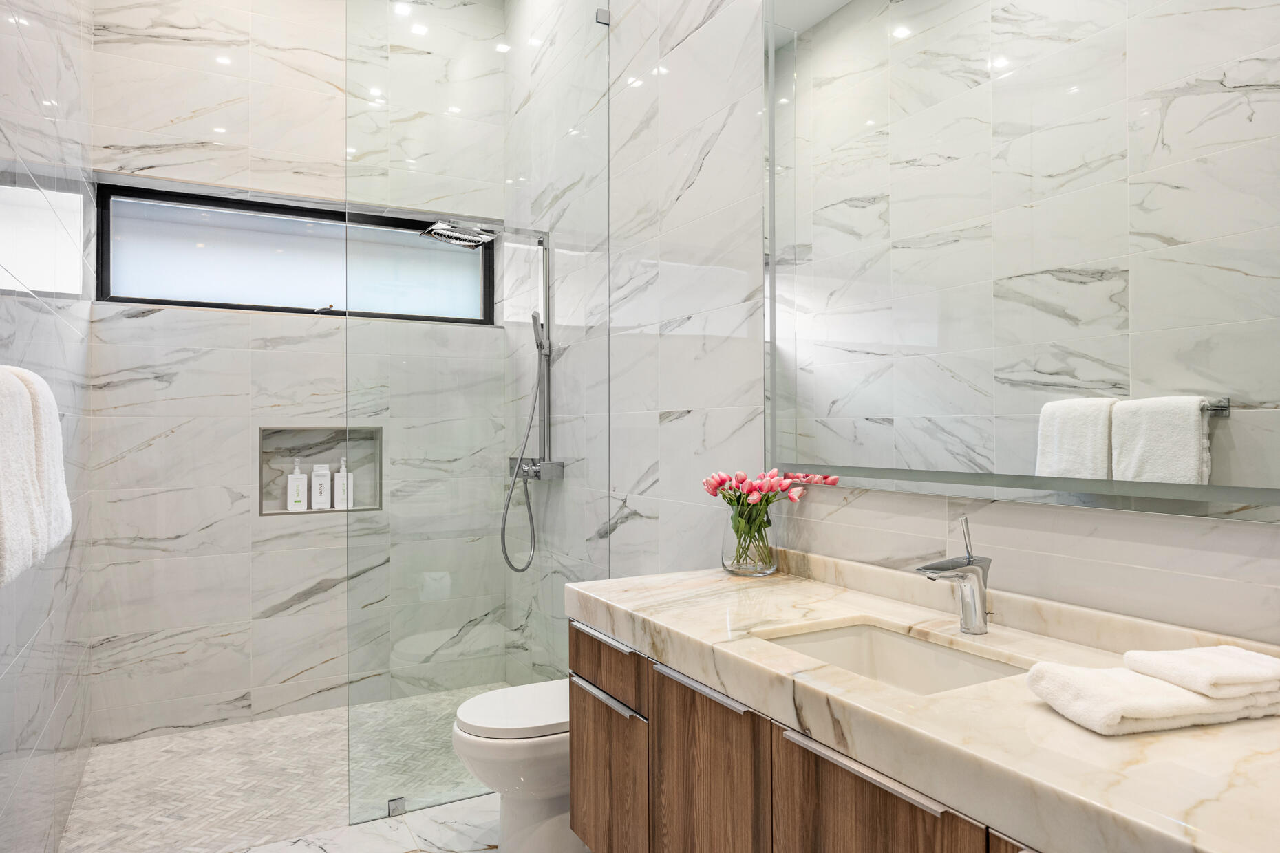 2 Bravo Court Rancho Mirage, CA 92270 - Photo 21 of 34 a bathroom with a granite countertop sink a toilet and shower