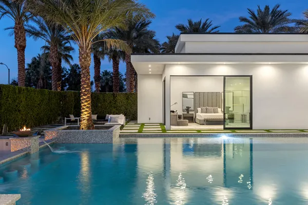 a view of a swimming pool with a lounge chairs