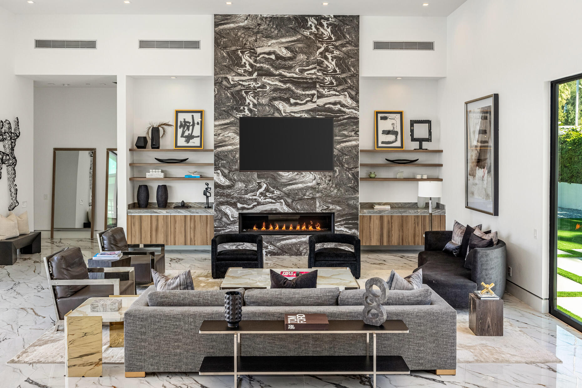 2 Bravo Court Rancho Mirage, CA 92270 - Photo 3 of 34 a living room with fireplace furniture and a flat screen tv