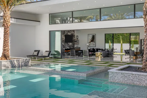 a view of swimming pool with outdoor seating