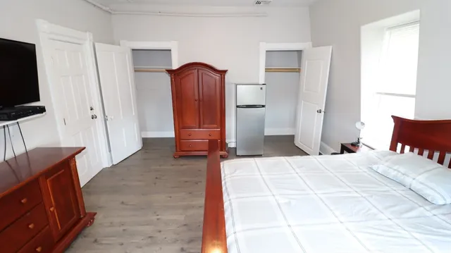 a room with furniture and a flat screen tv