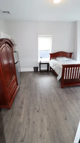 a room with a bed and a window