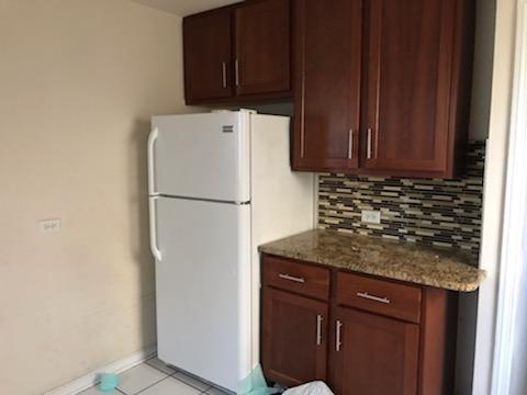 10641 South Sangamon Street Chicago, IL 60643 - Photo 5 of 16 a kitchen with a refrigerator and cabinets