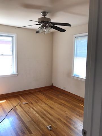 10641 South Sangamon Street Chicago, IL 60643 - Photo 6 of 16 wooden floor in an empty room with a window