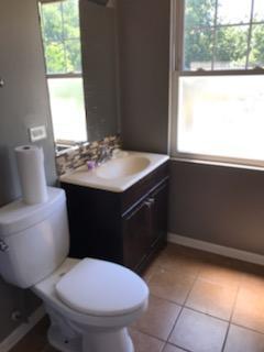 10641 South Sangamon Street Chicago, IL 60643 - Photo 7 of 16 a bathroom with a sink toilet and window