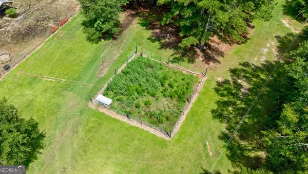 a sign board with yard in front of it