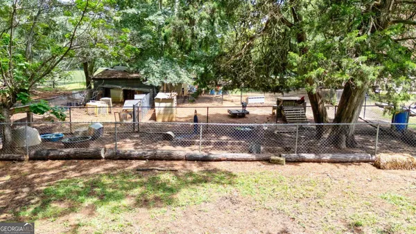 a view of a house with a yard and plants