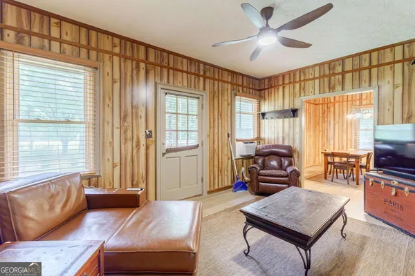 a view of a dining room with furniture and window