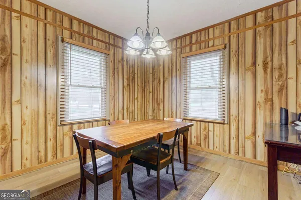 a view of a kitchen with microwave and cabinets