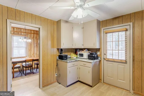 a kitchen with stainless steel appliances granite countertop a refrigerator a stove and a sink with cabinets