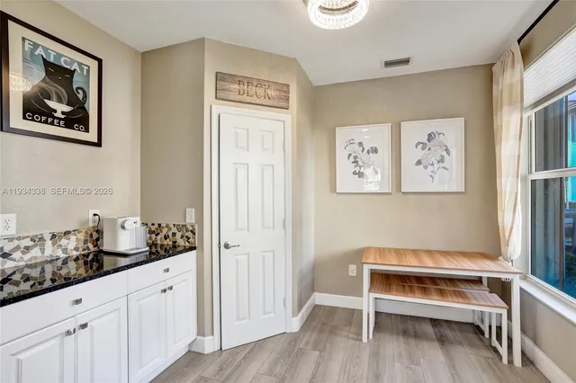 a bathroom with a sink vanity and a mirror