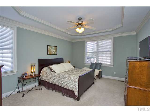 8717 Oregon Inlet Court Raleigh, NC 27603 - Photo 13 of 25 1st Floor Master convenient to stairs. Notice the ceiling; beautiful touch! Windows face back yard.