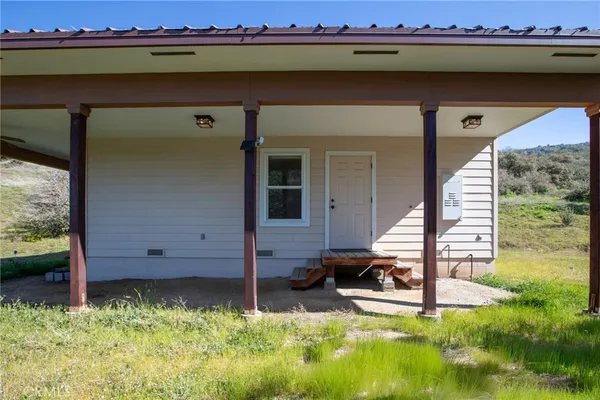 a view of a backyard of the house