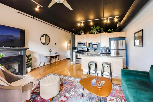 a large living room with fireplace furniture and a flat screen tv