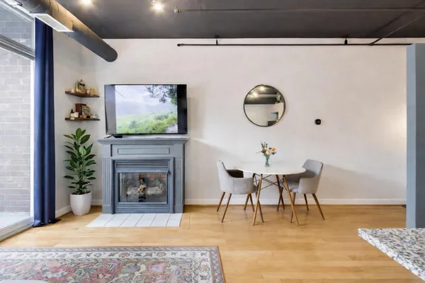 a view of a livingroom with furniture and a fireplace