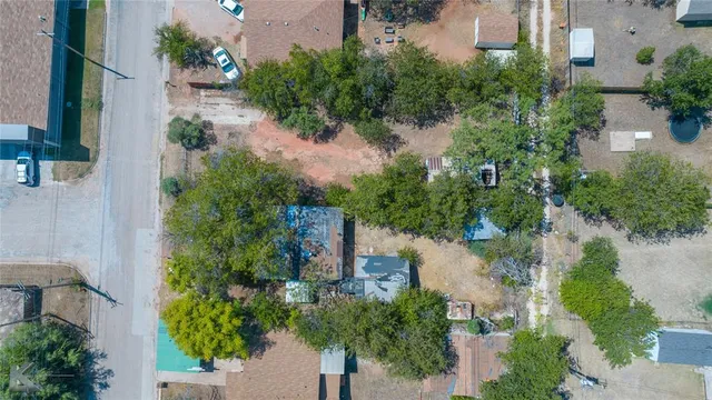 an aerial view of a house with outdoor space and lake view