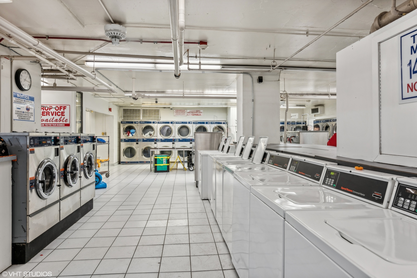 655 West Irving Park Road, Unit 5413 Chicago, IL 60613 - Photo 23 of 23 a utility room with multiple dryer and washer