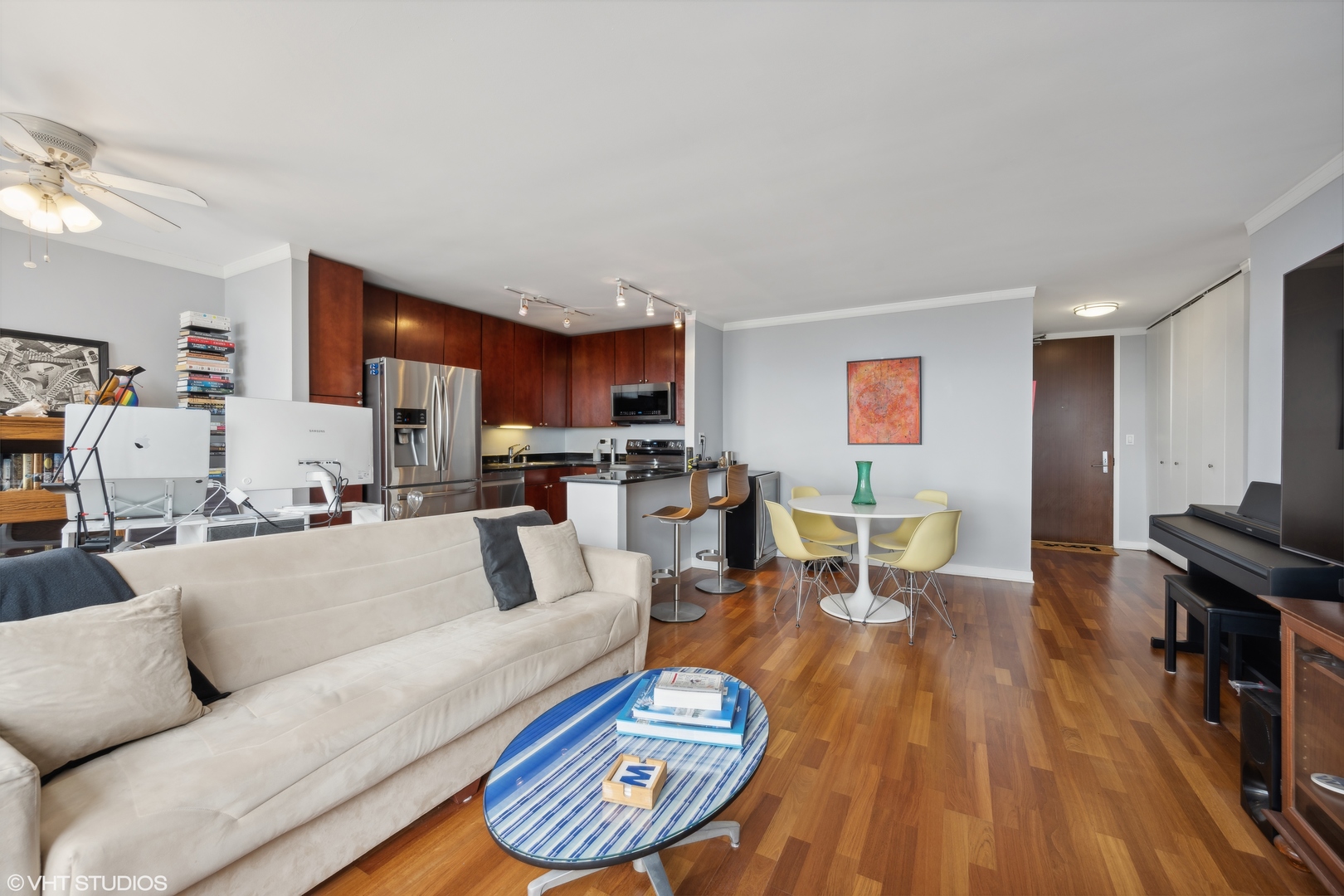 655 West Irving Park Road, Unit 5413 Chicago, IL 60613 - Photo 5 of 23 a living room with furniture and a wooden floor