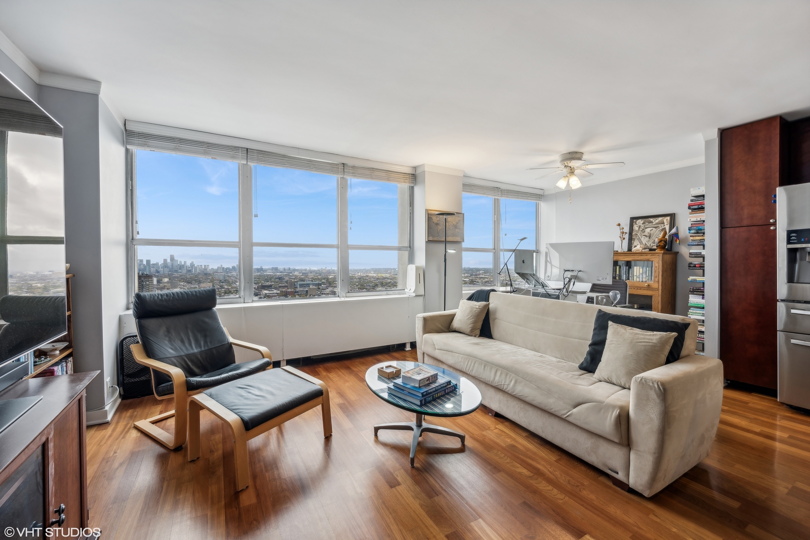 655 West Irving Park Road, Unit 5413 Chicago, IL 60613 - Photo 6 of 23 a living room with furniture and a large window