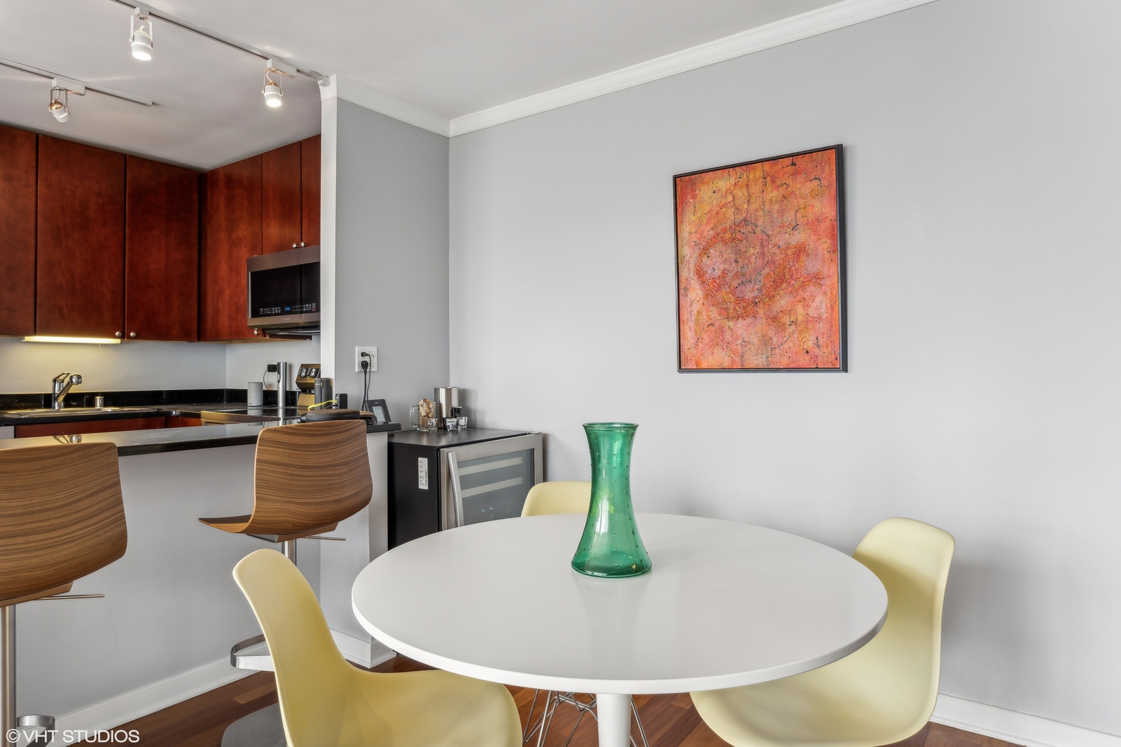 655 West Irving Park Road, Unit 5413 Chicago, IL 60613 - Photo 10 of 23 a kitchen with a table and chairs