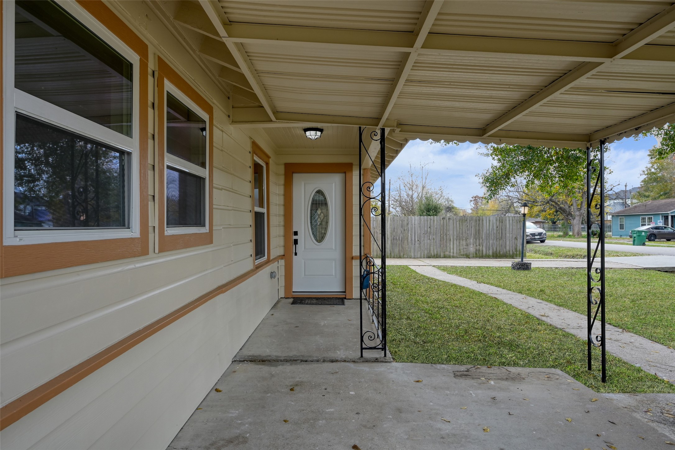 513 Barkley Street Houston, TX 77022 - Photo 5 of 48 This photo shows a covered front porch with a white door and decorative glass panel.