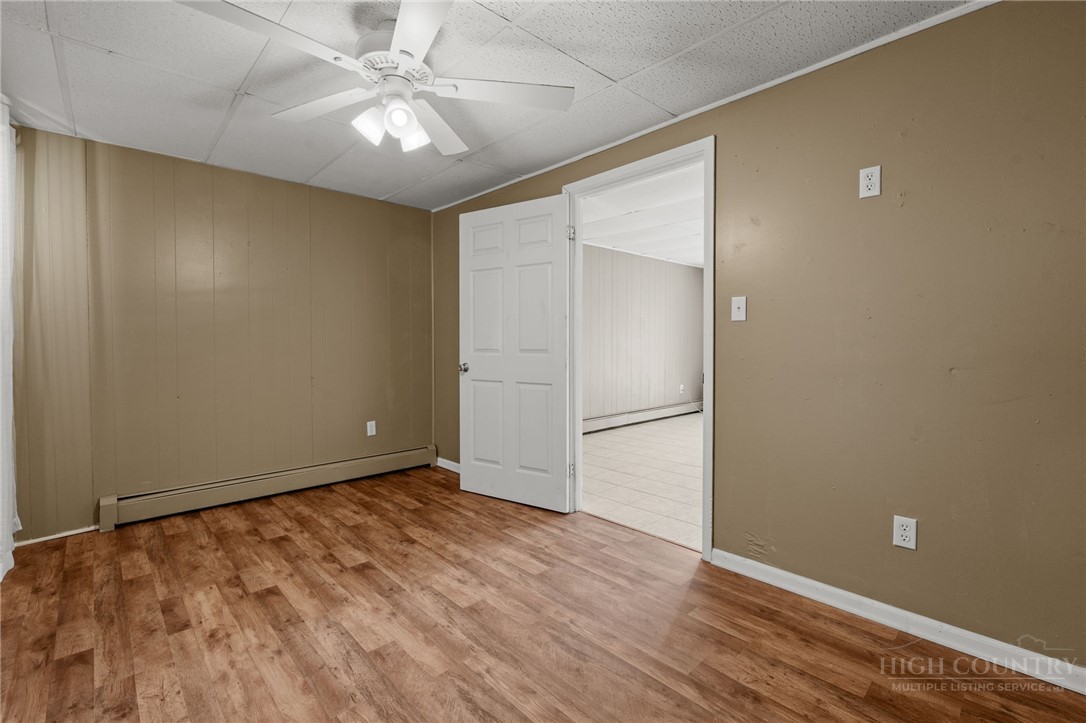 2345 Watauga River Road Sugar Grove, NC 28679 - Photo 32 of 50 wooden floor in an empty room