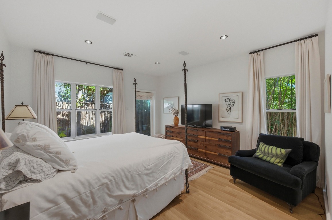 1712 West 10th Street Austin, TX 78703 - Photo 12 of 34 a large bedroom with a large bed and a couch