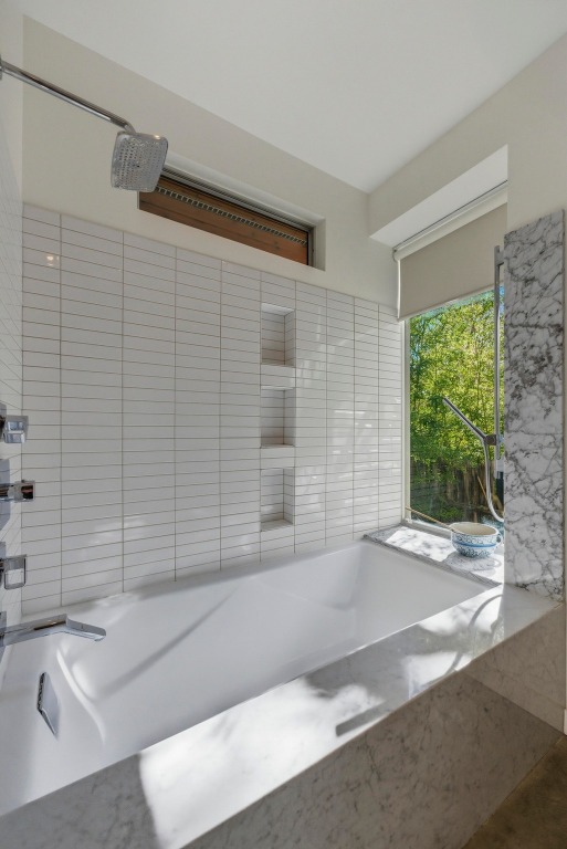 1712 West 10th Street Austin, TX 78703 - Photo 15 of 34 a bathroom with a bathtub and shower