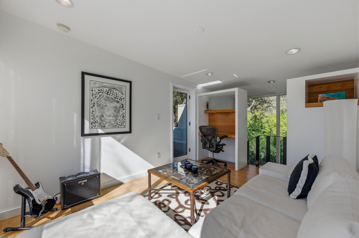 1712 West 10th Street Austin, TX 78703 - Photo 24 of 34 a living room with furniture and a window