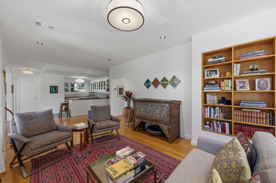 1712 West 10th Street Austin, TX 78703 - Photo 5 of 34 a living room with furniture a bookshelf and a fireplace