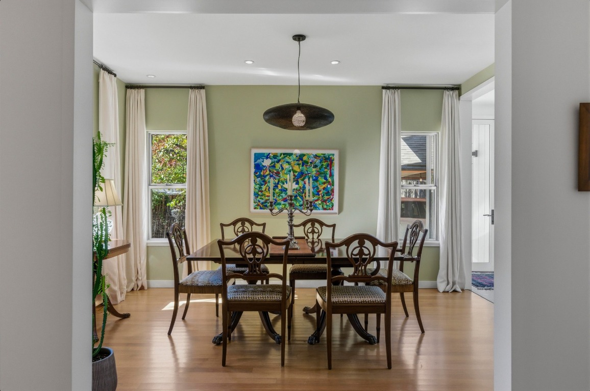 1712 West 10th Street Austin, TX 78703 - Photo 7 of 34 a view of a dining room with furniture window and wooden floor