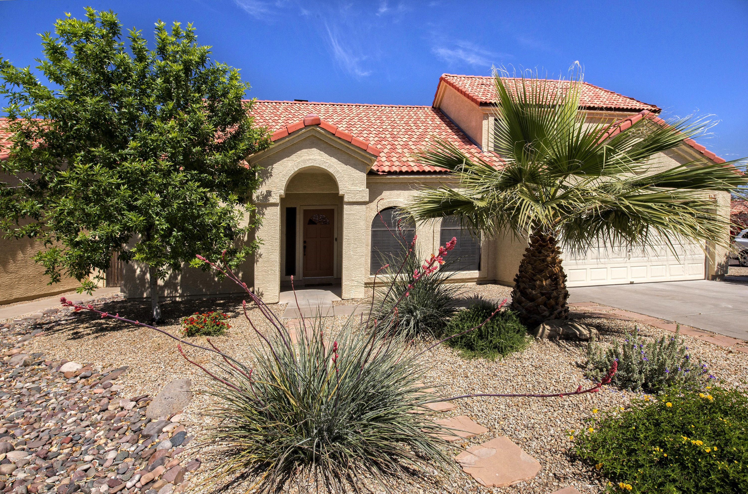 1268 East Mineral Road Gilbert, AZ 85234 - Photo 1 of 18 a front view of a house with a yard
