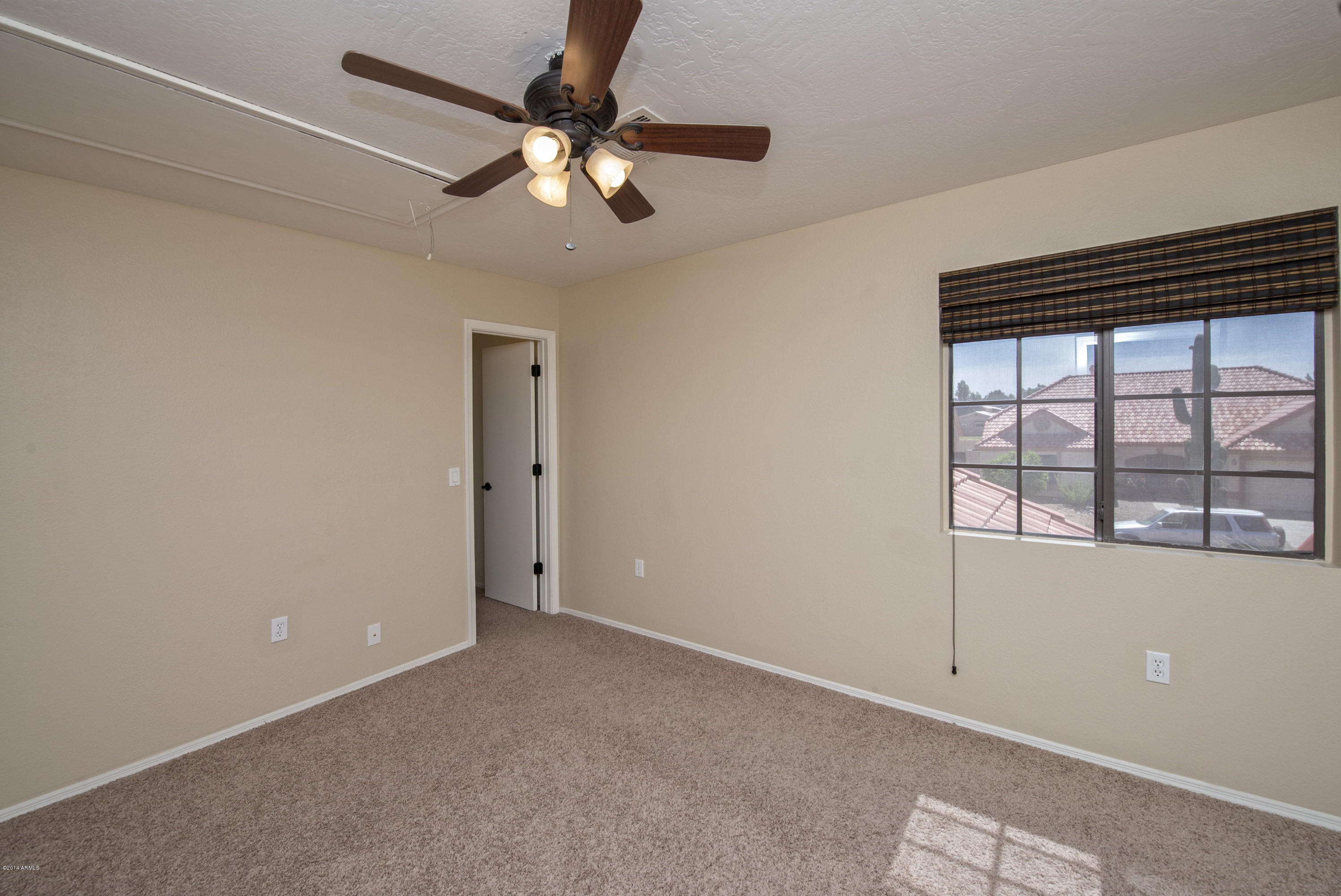 1268 East Mineral Road Gilbert, AZ 85234 - Photo 12 of 18 an empty room with windows and fan