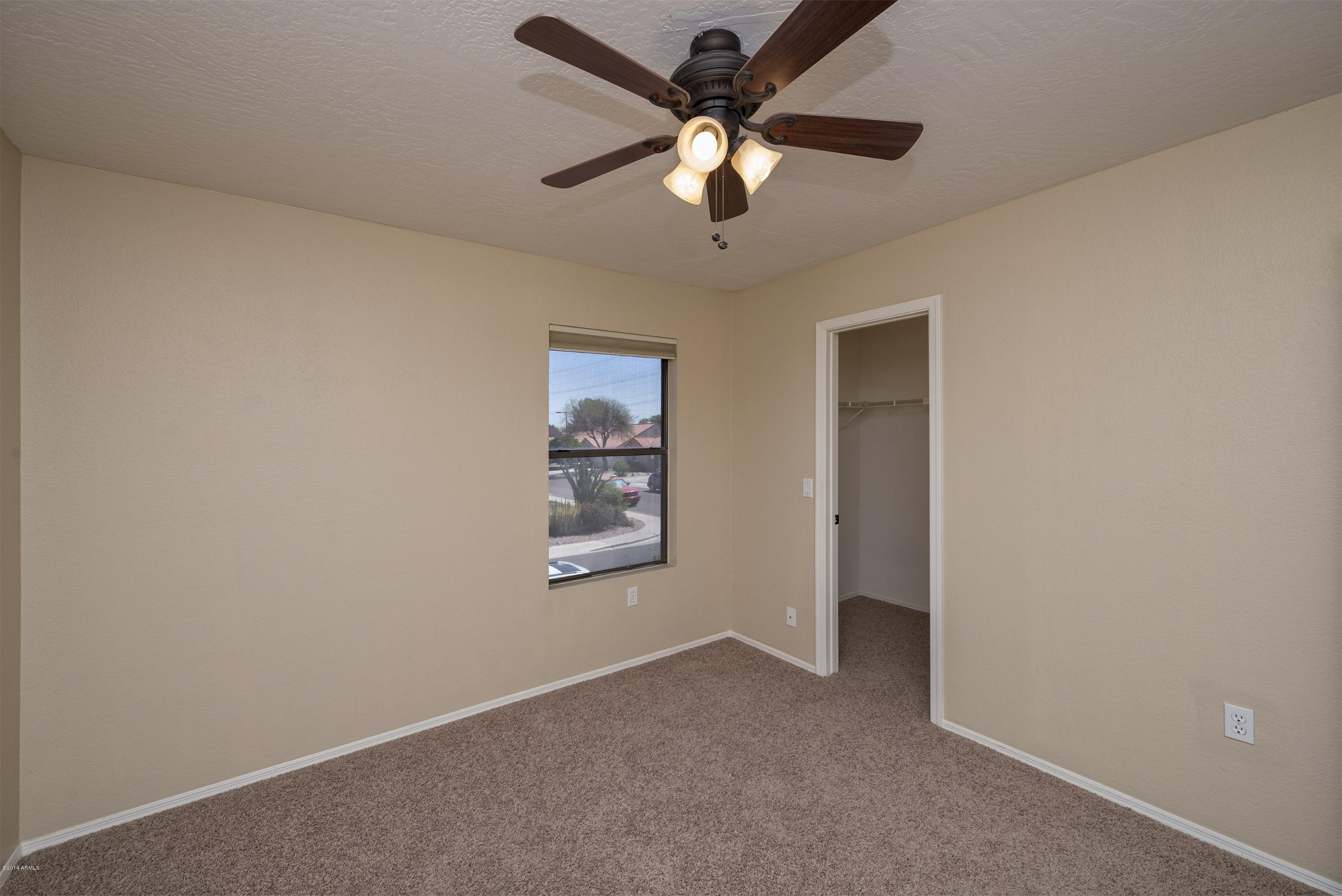 1268 East Mineral Road Gilbert, AZ 85234 - Photo 15 of 18 an empty room with windows and fan