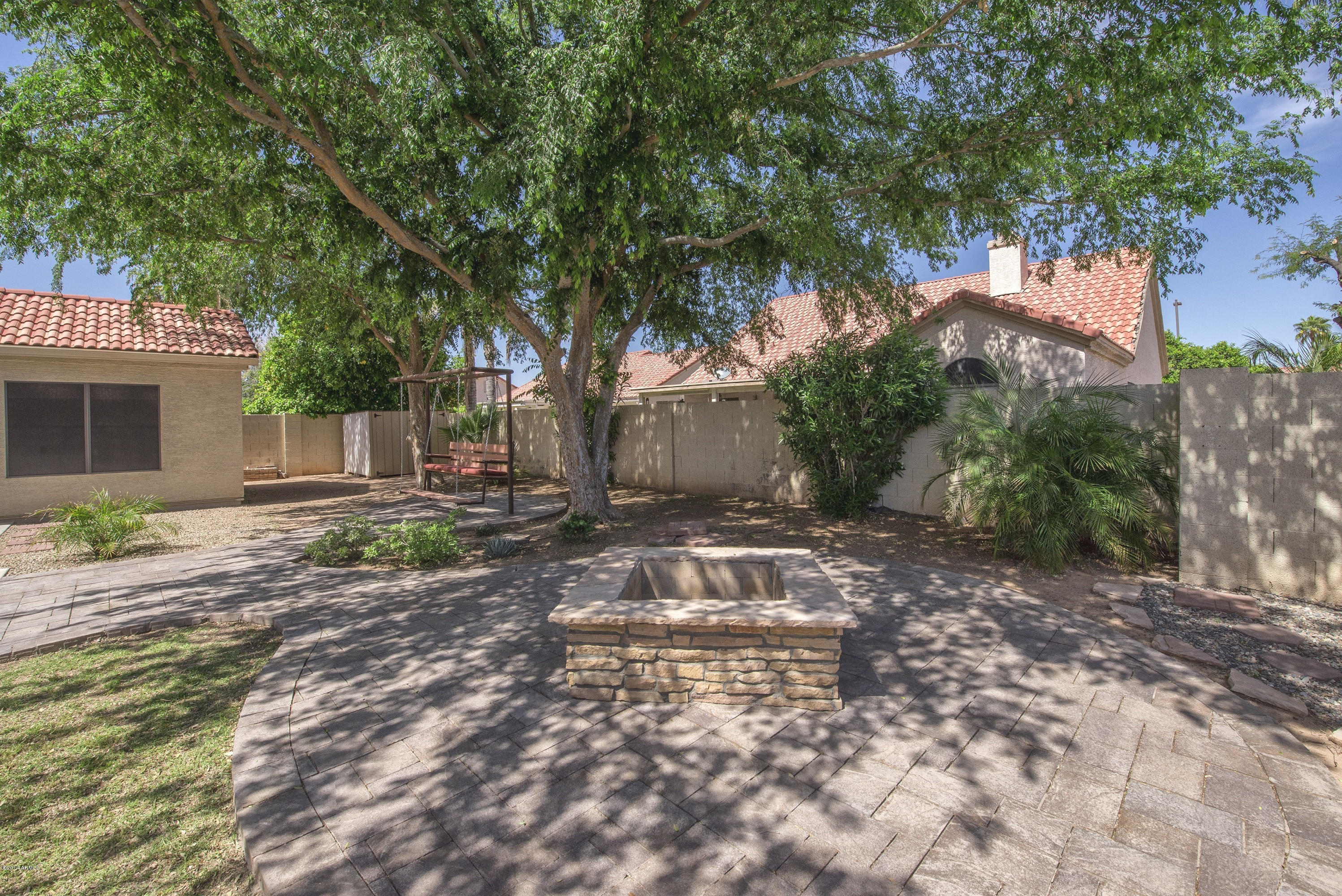 1268 East Mineral Road Gilbert, AZ 85234 - Photo 18 of 18 a view of a yard with plants and large trees