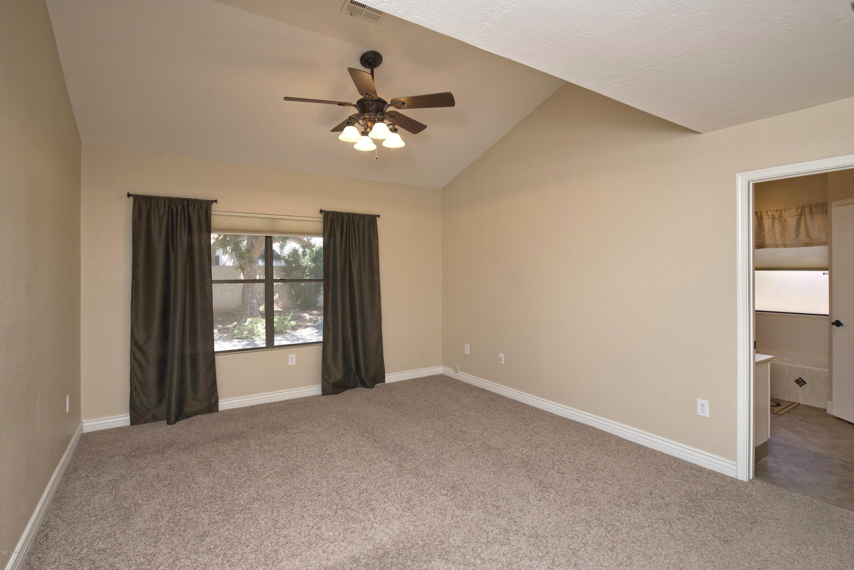 1268 East Mineral Road Gilbert, AZ 85234 - Photo 9 of 18 a view of an empty room with a window